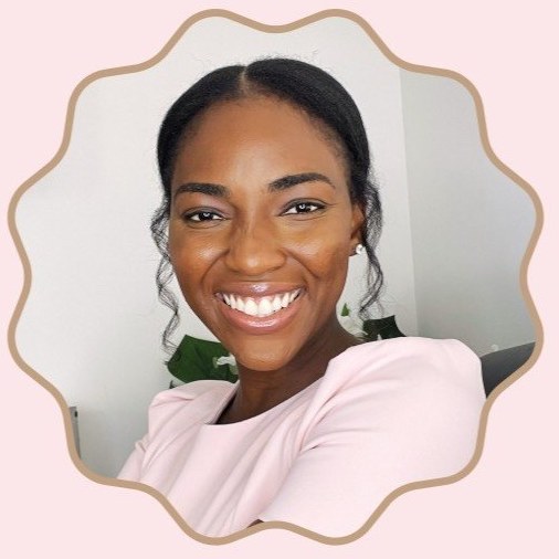 Bernadette Akpeko smiling, wearing a blush pink top